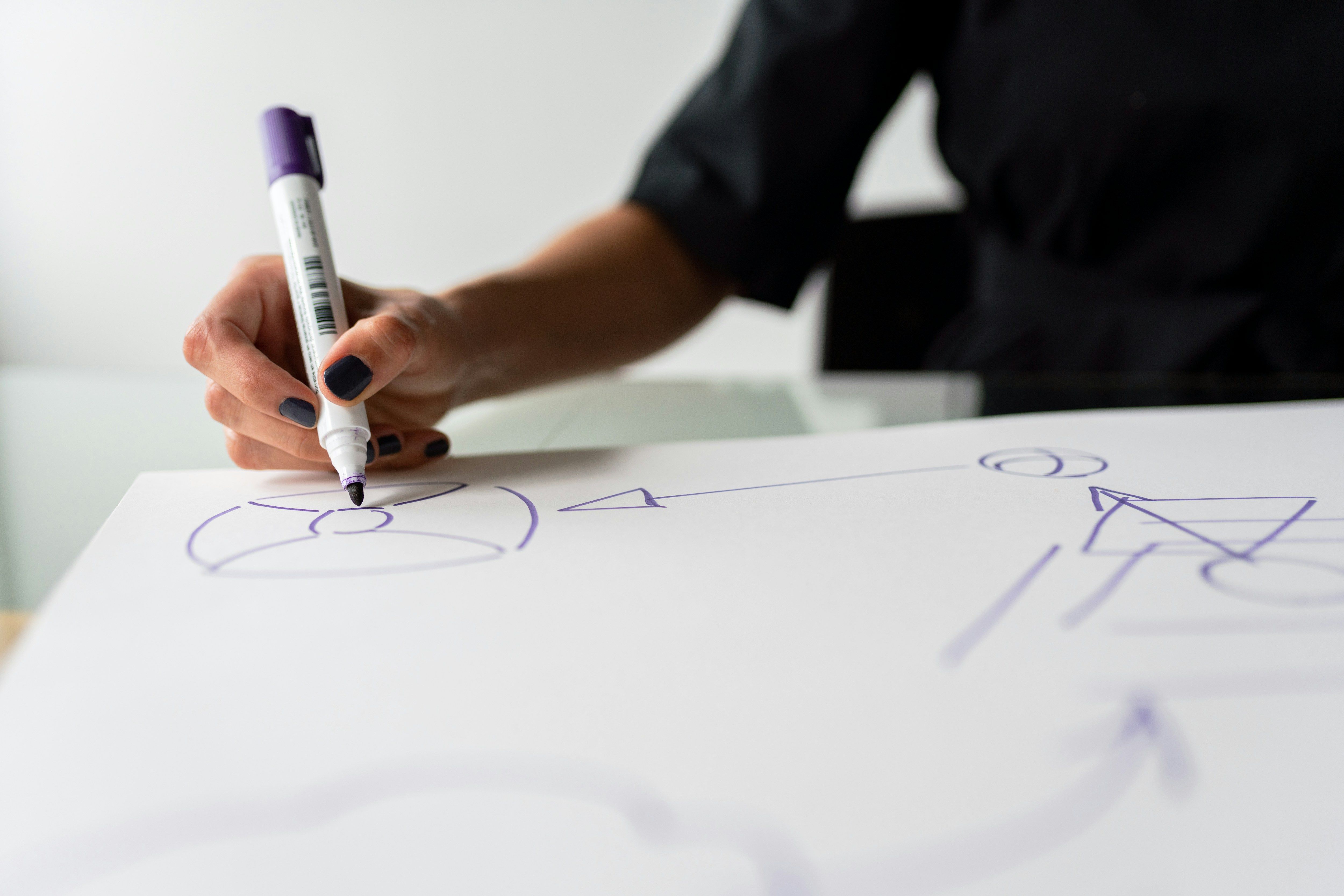 a person is writing on a piece of paper